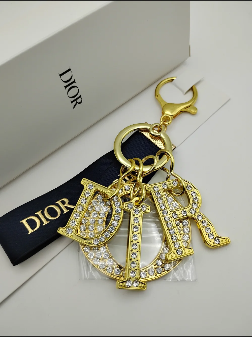 Dior Gold Crystal 'D I O R' Logo Keychain with Black Ribbon BNIB